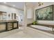 Stunning main bathroom boasts an elevated jacuzzi tub and designer finishes at 3610 Legareville Rd, Johns Island, SC 29455