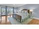 Spacious bedroom with wood floors, water view, and ensuite bathroom at 3610 Legareville Rd, Johns Island, SC 29455