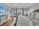 Bright main bedroom boasts French doors to a private deck and neutral decor at 3610 Legareville Rd, Johns Island, SC 29455