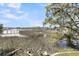 Scenic marsh view with native vegetation and a winding boardwalk with access to the property at 3610 Legareville Rd, Johns Island, SC 29455