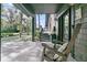 Charming front porch with a rocking chair and views of the beautiful front yard at 3610 Legareville Rd, Johns Island, SC 29455
