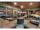 Inviting screened porch features a fire pit, comfortable seating, and serene waterfront views at 3610 Legareville Rd, Johns Island, SC 29455