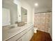 Bright bathroom featuring double sink vanity and decorative shower curtain at 362 Lake Ridge Blvd, Summerville, SC 29486