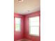 Bright bedroom with pink walls and two windows with white blinds at 362 Lake Ridge Blvd, Summerville, SC 29486
