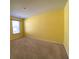 Bedroom with yellow walls, neutral carpet, and one window with blinds at 362 Lake Ridge Blvd, Summerville, SC 29486
