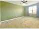Cozy bedroom with neutral carpet, green painted walls, and a sunlit window for comfortable living at 362 Lake Ridge Blvd, Summerville, SC 29486