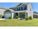 Lovely two-story home with a two-car garage and green lawn, perfect for Gathering living at 362 Lake Ridge Blvd, Summerville, SC 29486