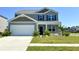 Charming two-story home with manicured lawn and a two-car garage, freshly painted in neutral tones at 362 Lake Ridge Blvd, Summerville, SC 29486