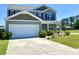 Attractive two-story home with a two-car garage and well-kept lawn, offering great curb appeal at 362 Lake Ridge Blvd, Summerville, SC 29486