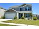 Well-maintained two-story house with neat landscaping, green lawn, and a two-car garage at 362 Lake Ridge Blvd, Summerville, SC 29486