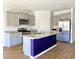 Modern kitchen featuring gray cabinets, granite countertops, stainless steel appliances, and an island at 362 Lake Ridge Blvd, Summerville, SC 29486