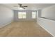 Spacious loft area featuring ceiling fan and two large windows at 362 Lake Ridge Blvd, Summerville, SC 29486