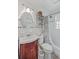 Bathroom featuring a vanity with sink, toilet, shower/tub combo with shower curtain, and round mirror at 364 Dupre Rd, McClellanville, SC 29458