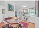 Updated kitchen with stainless appliances, white cabinets, and cozy breakfast bar area at 364 Dupre Rd, McClellanville, SC 29458