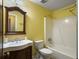 Full bathroom with yellow walls and a shower-tub combo at 411 Red Fox Run, Summerville, SC 29485