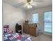 Bedroom featuring two windows and beige carpet, in the process of being moved out of at 411 Red Fox Run, Summerville, SC 29485