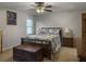 Cozy bedroom with a comfortable bed, side tables, and natural light from the window at 411 Red Fox Run, Summerville, SC 29485