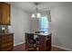 Charming dining area with a table and chairs near a window, illuminated by a chandelier at 411 Red Fox Run, Summerville, SC 29485