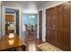 Welcoming entryway showcasing hardwood floors and glimpses into the dining room and kitchen at 411 Red Fox Run, Summerville, SC 29485