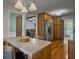 Charming kitchen with an island and granite countertops, offering ample space and functionality at 411 Red Fox Run, Summerville, SC 29485