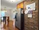 Kitchen featuring stainless steel refrigerator, brick accent wall, and breakfast bar at 411 Red Fox Run, Summerville, SC 29485