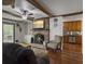 Inviting living room with brick fireplace, built-in shelves, and a view into the kitchen at 411 Red Fox Run, Summerville, SC 29485