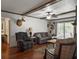 Comfortable living room with hardwood floors, a ceiling fan, and an abundance of natural light at 411 Red Fox Run, Summerville, SC 29485