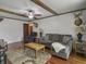 Open-concept living room featuring hardwood floors, a comfortable seating area, and unique decor at 411 Red Fox Run, Summerville, SC 29485