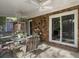 Covered screened porch with outdoor furniture and sliding glass door to interior at 411 Red Fox Run, Summerville, SC 29485