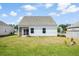 View of back of house and backyard area with a screened in porch at 412 Pender Woods Dr, Summerville, SC 29486