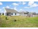 Spacious backyard with a screened porch and views of neighboring properties at 412 Pender Woods Dr, Summerville, SC 29486