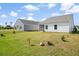 A spacious backyard offers plenty of space for activities at 412 Pender Woods Dr, Summerville, SC 29486