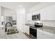 Bright kitchen featuring stainless steel appliances, granite countertops, and white cabinets at 412 Pender Woods Dr, Summerville, SC 29486