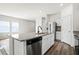 Kitchen island featuring granite countertops, stainless steel dishwasher, and stylish black faucet at 412 Pender Woods Dr, Summerville, SC 29486