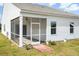 The outdoor screened porch features a ceiling fan and access to the yard at 412 Pender Woods Dr, Summerville, SC 29486