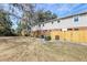 Large backyard with wood fence and mature trees at 415 Parkdale Dr # 12D, Charleston, SC 29414