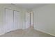 Bedroom featuring carpet floors, neutral paint, a closet with folding doors, and white trim at 415 Parkdale Dr # 12D, Charleston, SC 29414