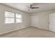 Bright bedroom features a ceiling fan, carpet floors, a window with natural light, and a closet at 415 Parkdale Dr # 12D, Charleston, SC 29414