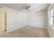 Bedroom features carpet floors, a ceiling fan, a window for natural light, and neutral paint at 415 Parkdale Dr # 12D, Charleston, SC 29414