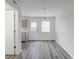 Dining area features stylish pendant lighting, wood floors and access to kitchen at 415 Parkdale Dr # 12D, Charleston, SC 29414