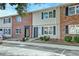 Charming townhome exterior with brick and siding facade and dark shutters at 415 Parkdale Dr # 12D, Charleston, SC 29414