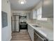 Charming kitchen features stainless appliances, gray cabinets and ample counter space at 415 Parkdale Dr # 12D, Charleston, SC 29414