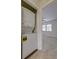Conveniently located stacked washer and dryer; bedroom in the background with a ceiling fan at 415 Parkdale Dr # 12D, Charleston, SC 29414