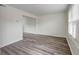 Bright living room features wood flooring and large windows for natural light at 415 Parkdale Dr # 12D, Charleston, SC 29414