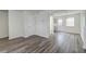 View of living room and dining room featuring luxury vinyl plank flooring and white trim at 415 Parkdale Dr # 12D, Charleston, SC 29414