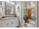 Bathroom featuring framed mirror, granite countertop, white cabinets, and glass-enclosed shower at 421 Royal Assembly Dr, Charleston, SC 29492