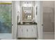 Bathroom featuring white vanity, framed mirror, granite countertop, and glass-enclosed shower at 421 Royal Assembly Dr, Charleston, SC 29492