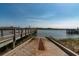 Concrete boat ramp leading to a weathered pier provides access to the waterway at 421 Royal Assembly Dr, Charleston, SC 29492