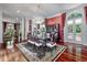 Dining room featuring hardwood floors, a chandelier, and access to the kitchen and living areas at 421 Royal Assembly Dr, Charleston, SC 29492