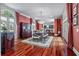 Dining room featuring hardwood floors, a chandelier, and access to the kitchen and living areas at 421 Royal Assembly Dr, Charleston, SC 29492